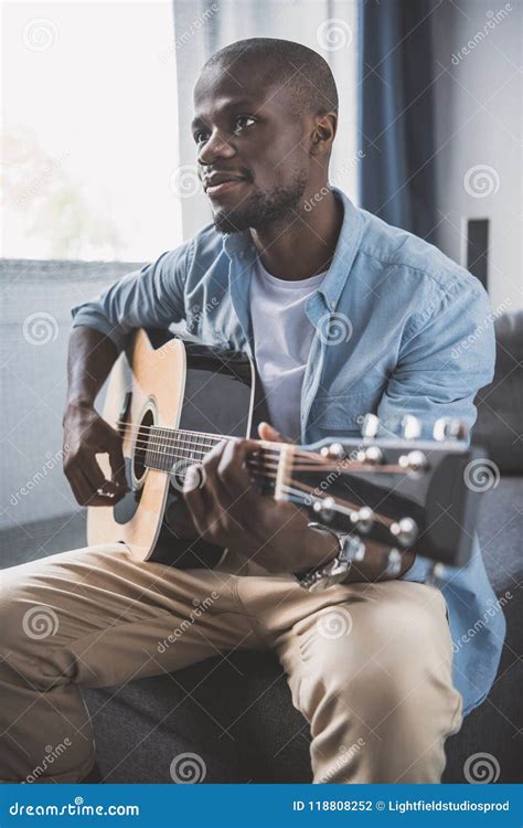 African American Man Playing Acoustic Guitar Stock Photo - Image of acoustic, indoors: 118808252