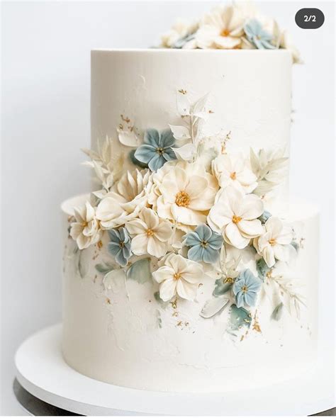 Blue Silver Wedding Cake With Floral Decorations