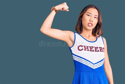 Young Beautiful Chinese Girl Wearing Cheerleader Uniform Strong Person