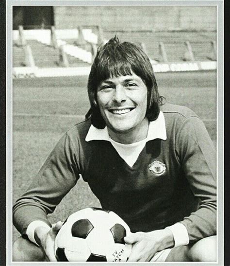 A Black And White Photo Of A Person Holding A Soccer Ball