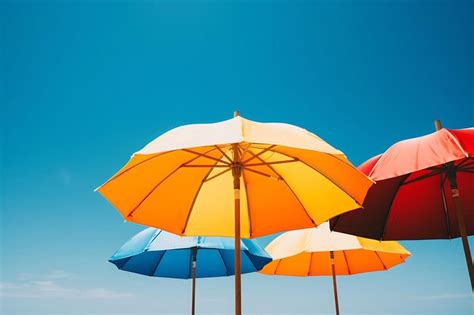 premium photo colorful beach umbrellas   clear sky