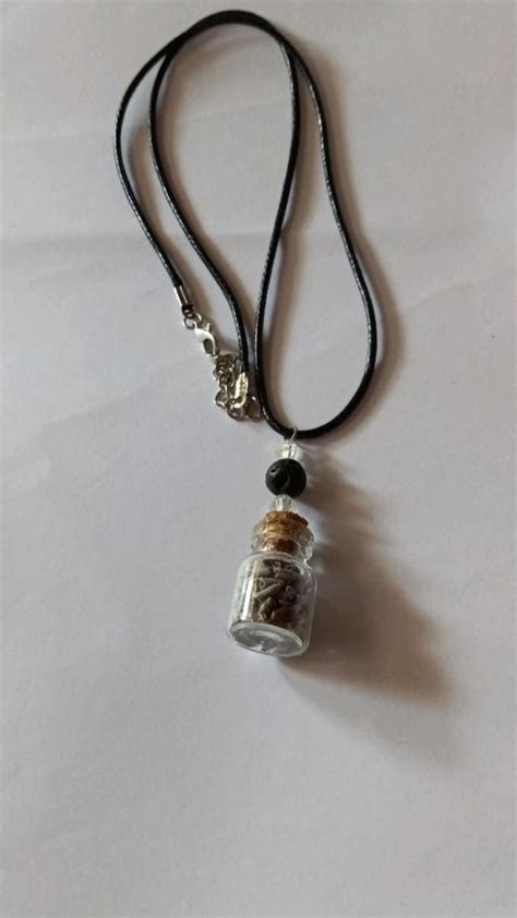 Aromatherapy Bottle Necklace With Black Lava Bead And Crystals On Black