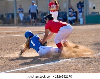 Girls Softball Player Sliding Into Base Stock Photo 1126882190