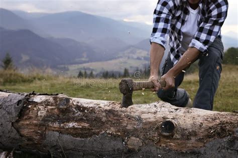 Man with Axe Cutting Tree Log in Mountains, Closeup Stock Photo - Image ...