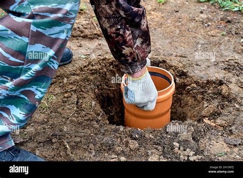 installation of a polyethylene pipe in a water well Stock Photo - Alamy