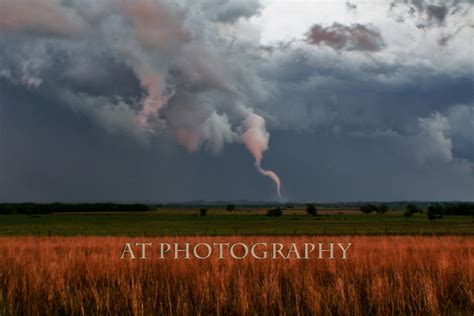 A Rope Tornado Forms on the Kansas Prairie From a Rainy Day Storm Cloud ...