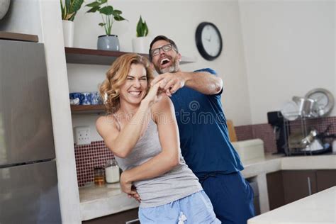 Happy Hearts Happy Home A Happy Middle Aged Couple Dancing In The