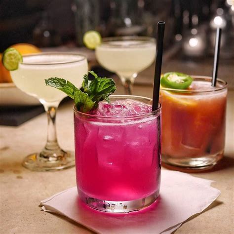 Three Different Types Of Cocktails On A Table