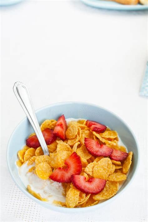 Bowl Of Cornflakes And Strawberries Stock Image Image Of Bowl Flakes