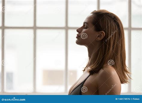 Portrait Of Beautiful Woman Meditating With Closed Eyes Practicing