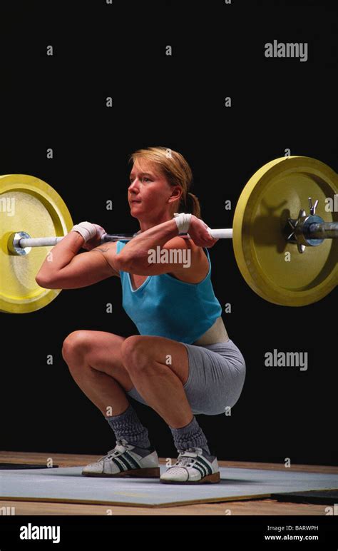 Female Olympic Style Weightlifter In Action Stock Photo Alamy