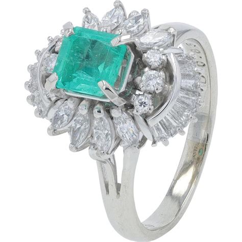 Platinum 068 Carat Emerald Ring With 083 Carat Total Diamond Halo