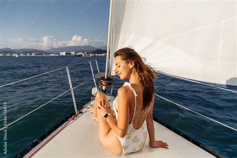 Fashion Outdoor Summer Photo Of Sexy Girl With Dark Hair In Luxurious Bikini Relaxing On Yacht