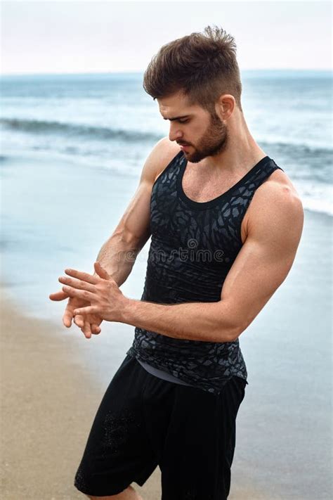 Handsome Man with Fit Muscular Body in Sportswear on Beach. Stock Image ...