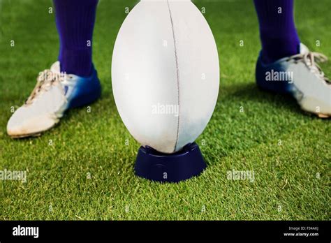 Rugby player ready to make a drop kick Stock Photo - Alamy