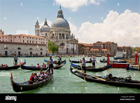 Gondolas On The Grand Canal In Front Of Chiesa Di Santa Maria Della