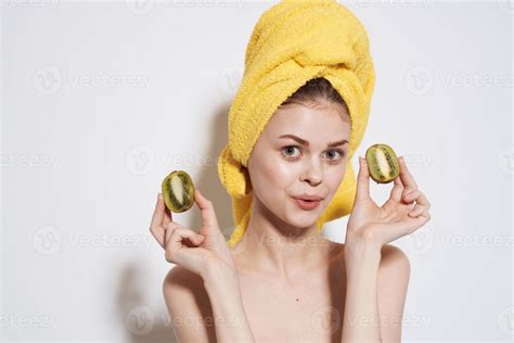 Cheerful Woman Naked Shoulders Kiwi In The Hands Of Pure Skin Natural Cosmetics Stock
