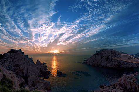 Tierra Puesta de sol Puente Nube Costa Horizonte Océano Roca