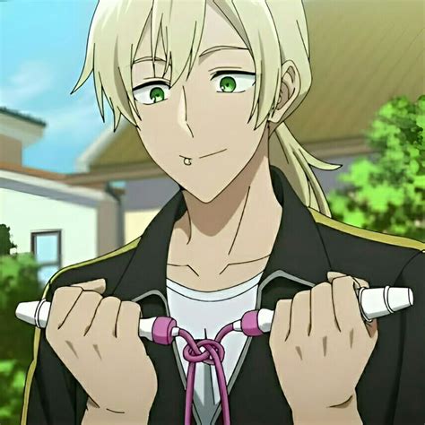 An Anime Character With Blonde Hair And Green Eyes Is Holding Two White