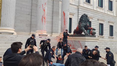 Activists Throw Red Paint On Madrid Parliament Building IHA News