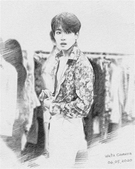 A Black And White Photo Of A Boy In A Floral Jacket With His Hands On