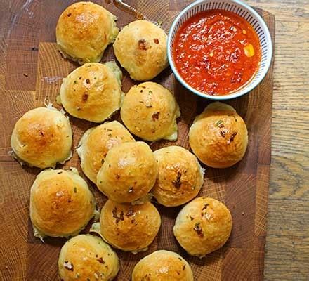 Cheese-stuffed garlic dough balls with a tomato sauce dip recipe | BBC ...