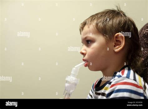 The Boy Making Inhalation With Nebulizer At Home Stock Photo Alamy