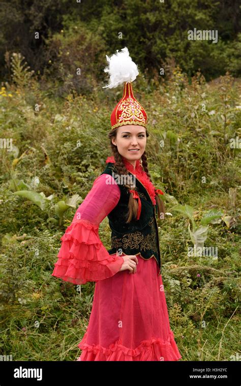 Young Woman In Traditional Kazakh Dress With Takiya Skull Cap With