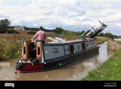 Narrowboat Passing Under A Lifting Bridge On The Oxford Canal