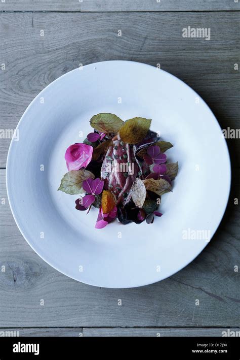 Plate of fish with herbs Stock Photo - Alamy