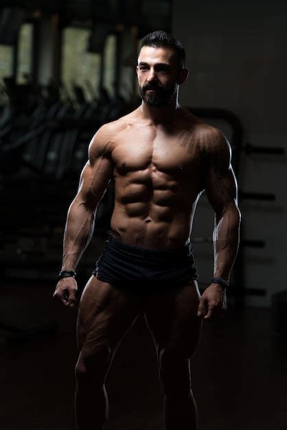 Premium Photo Man In Gym Showing His Well Trained Body