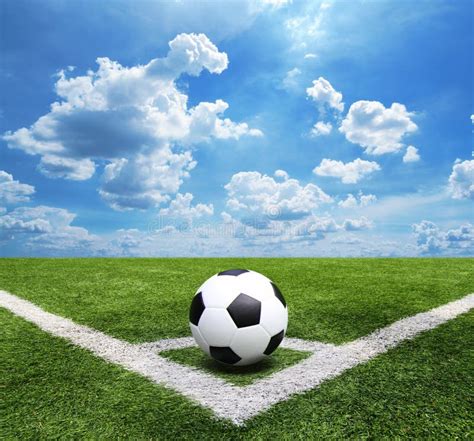 Football And Soccer Field Grass Stadium Blue Sky Background Stock Photo