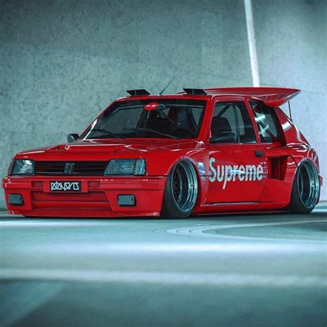 A Red Car With The Word Supreme Painted On It