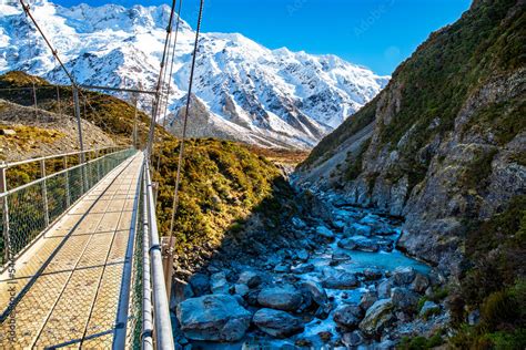 Crossing The Hooker Valley On An Empty Swing Bridge On The Walk Through