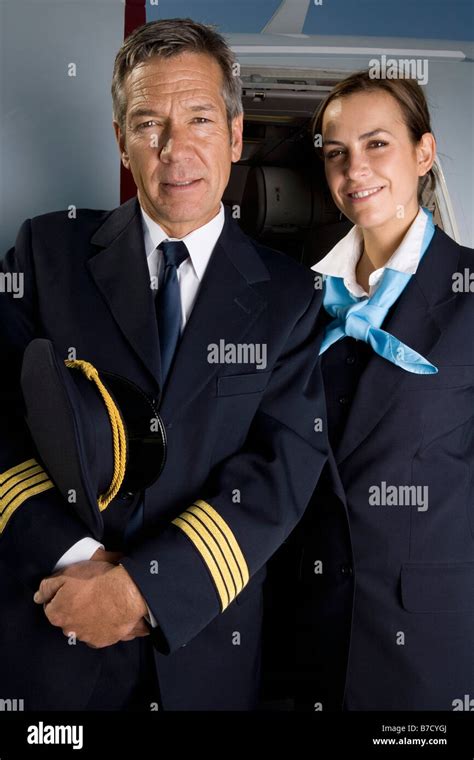 A Pilot And A Flight Attendant Standing Outside A Plane Stock Photo Alamy