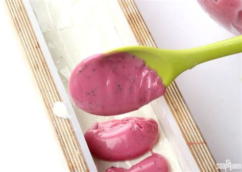 A Spoon With Some Pink Food On It