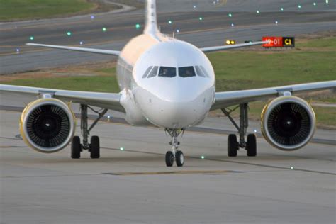 An Airplane That Is On The Runway Ready To Take Off Or Leave For