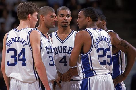 Mike Dunleavy of the Duke Blue Devils listens to Chris Carrawell with ...