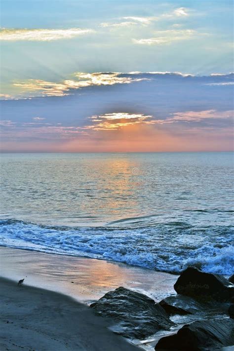 Beautiful Beach Sunrise On A Summer Morning At Rock Jetty Stock Photo