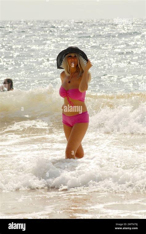 Russian singer Nadeea Volianova takes a stroll along the beach and ...