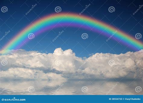 Fluffy clouds with rainbow stock image. Image of azure - 28554733