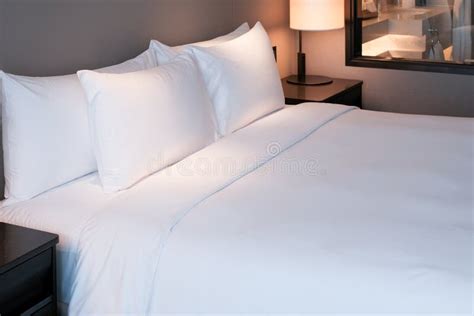 A Hat Are On The White Bed In The Hotel Stock Image Image Of