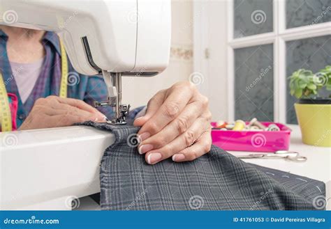 Seamstress Hands Working On A Sewing Machine Stock Image Image Of