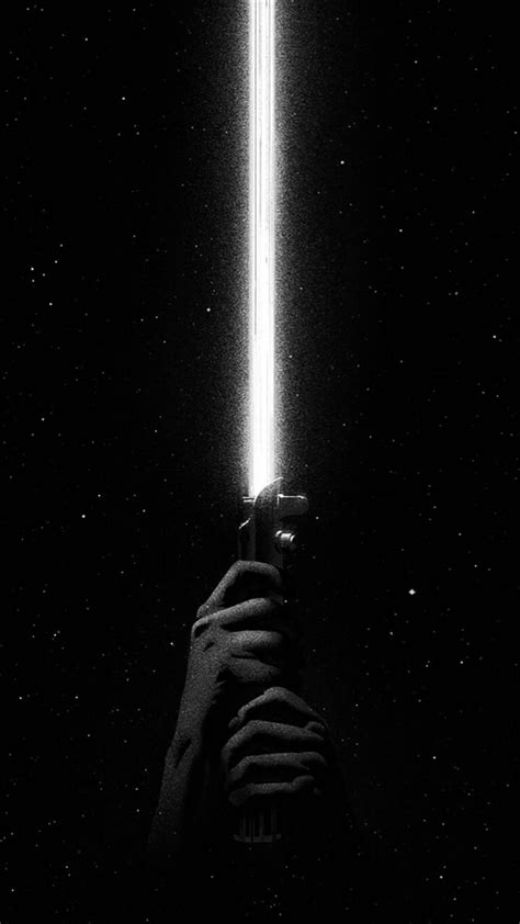 a person holding a light saber in the dark with stars behind them and ...