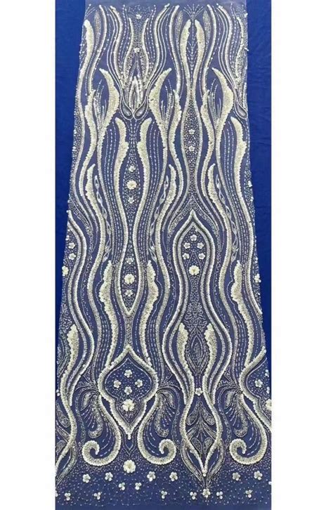 A Blue And White Lace With Beads On It