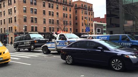 Nypd Tow Truck Towing A Nypd Traffic Enforcement Van On 10th Ave In