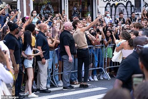 Shawn Mendes Shows Off Toned Arms In Clinging Nude Tank Top As He Greets Fans Daily Mail Online