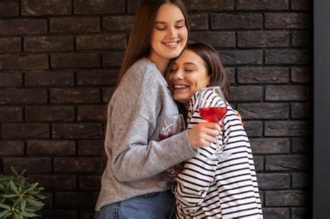 Free Photo Two Female Friends Hugging Each Other