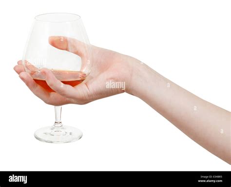 Hand Holds Glass Goblet With Brandy Isolated On White Background Stock