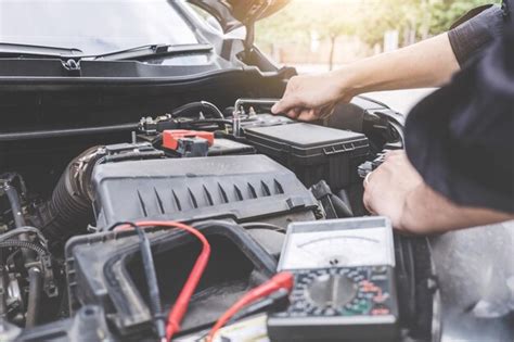 Premium Photo Cropped Hands Of Mechanic Repairing Car Engine